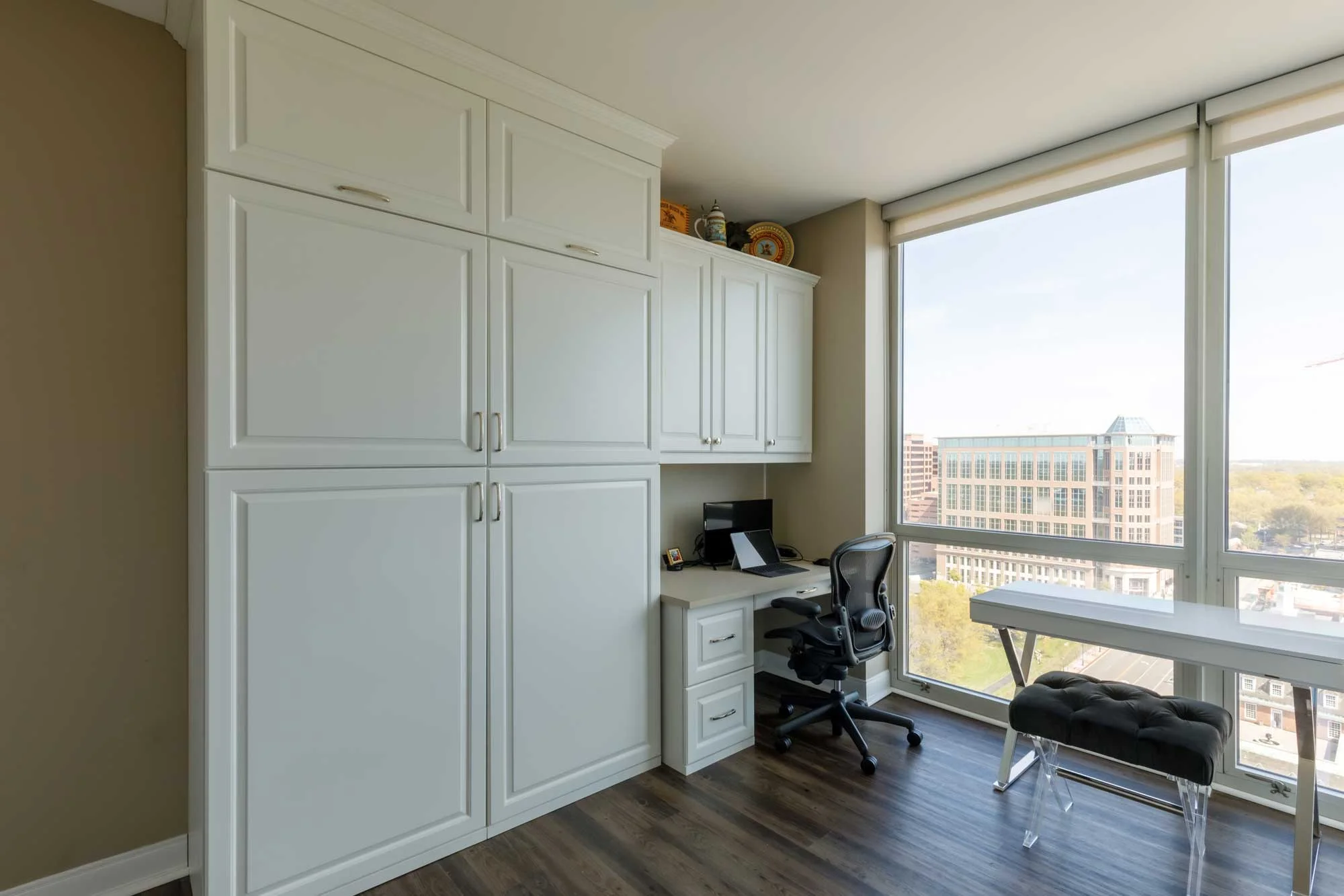 Home office with white custom cabinetry