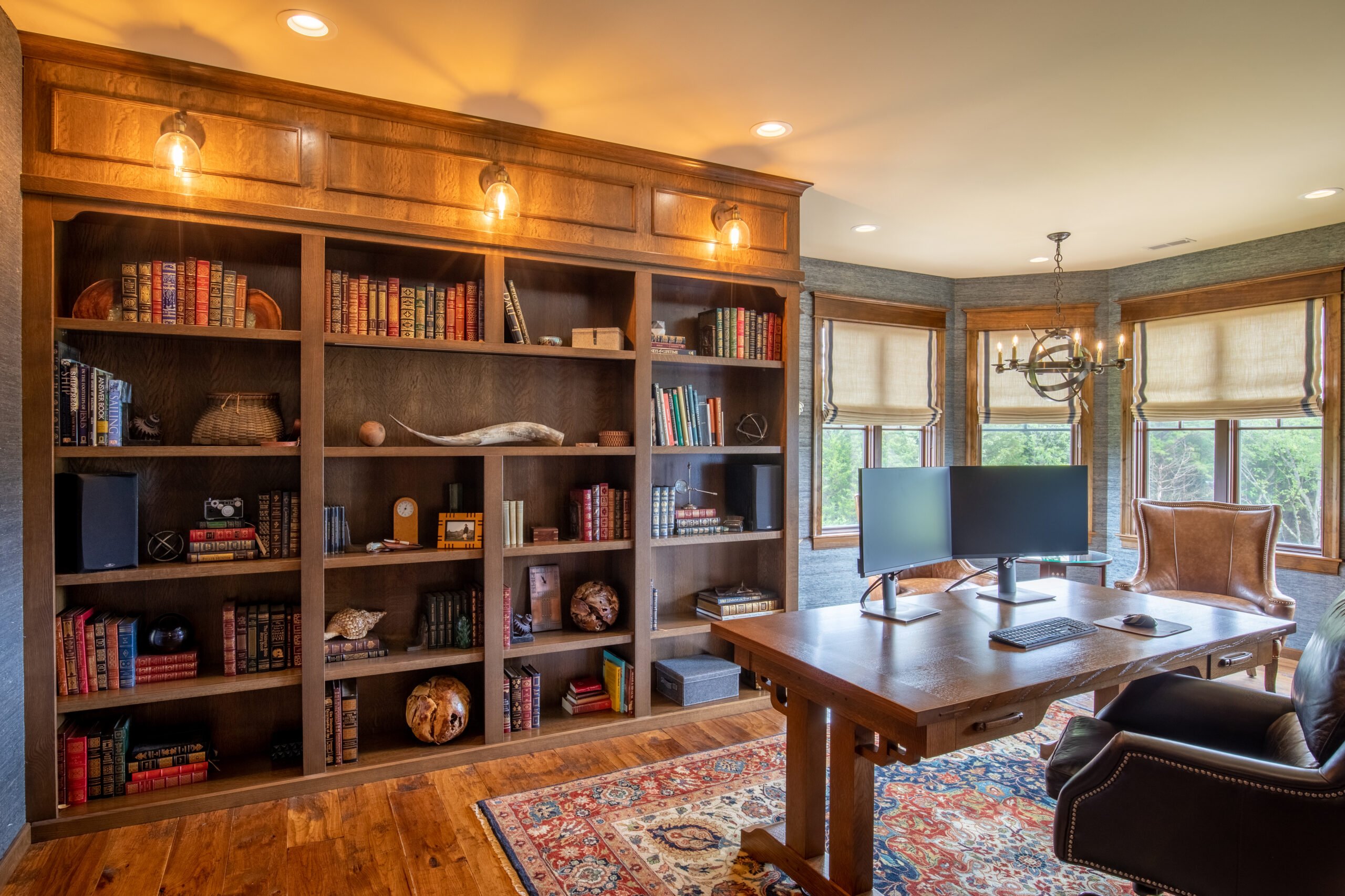 custom corner desk with built-in dark wood cabinetry